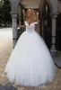 Luxury Beaded Crystal Ball Gown Bröllopsklänningar från Axel Cap Sleeves Tulle Custom Made Wedding Dress Vestido de Novia