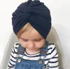 New Europe Fashion Infant Baby Hat Kids Kink Knot Caps Solid Color Biggin Girls Children Skull Cap Hats A628