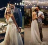 2019 New Romantic A Line Wedding Dresses Spaghetti V-Neck Applique Lace Tulle Sleeveless Backless Sweep Train Arabic Wedding Bridal Gowns