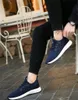 2020 Herren Casual Flying Line Strickbrettschuhe Trend Gummiband Sport atmungsaktive rutschfeste verschleißfeste wilde Herrenschuhe