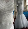 Robes de mariée sirène de luxe pleine perlée Sheer Jewel Neck manches longues robes de mariée perles sud-africaines Slim étage longueur robe de mariée