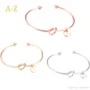 L'Europe et les États-Unis bracelets joncs noués personnalité sauvage trois couleurs 26 lettres combinaison gratuite bracelet gros noeud rose