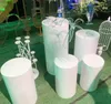 5ピースの丸いシリンダーペデスタルディスプレイアートの装飾の台紙の柱はDiyの結婚式の装飾の休日のデザートテーブル