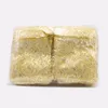 100 stks / partij gouden wimper organza sieraden pouches 12x9cm champagne snoep geschenk sieraden verpakking tas bruiloft gunst tassen oorbel opslag
