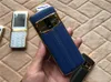 Olåst super Mini lyx mobiltelefon för man Dubbla simkort mode metallram rostfritt stål Läderbaksida MP3 kamera mobiltelefon