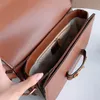 Новая роскошная ретро -седловая сумочка вставка пряжка подлинная кожаная дизайнерская сумка для плеча мессенджера мешка с лопави