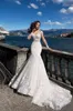 Nyaste 2020 Mermaid Bröllopsklänningar Långärmad Sheer Backless Appliqued Illusion Bodice Bohemian Beach Bridal Gowns Vestidos de Novia