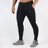 Mens Jogger Fitness Calças Casuais Estiramento Algodão Mens Fitness Exercício Bordado Calças De Esportes Calças Jogging Asiático Tamanho M-2XL