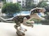 Mini figurki jurajski park dinozaur dzieci narożne Bloki bloki velociaptor tyranosaurus rex but oxe