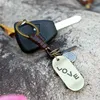 Kärlek Skateboard Nyckelringar Antik Silver Letter Tag Keychain Weave Holder Mode Smycken Will och Sandy Drop Ship