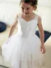 New Short Girl Girl Dress For Weddings 2019 Spaghetti Criss Cross cinghie Girls Pageant Dress Bambino Birthday Party abiti prima comunione