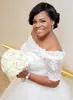 Nigeria Lace Off Shoulder Trouwjurken Sheer Halve Mouwen Beaded Lace Up Plus Size Bruidsjurken A Line Afrikaanse Bruiloft vestidos242s