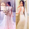Robes de mariée sirène de luxe à manches longues col haut perles de dentelle avec train détachable robes de mariée grande taille Dubaï arabe robes de Novia