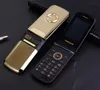 Vänd 2,4 tum skärm mobiltelefoner metall kropp dubbel simkort mp3 fm guld telefon stor tangentbord bokstäver modedesign mobil mobiltelefon