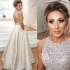 Jewel Top Beaded Prom Klänningar Lång Puffy Sequin Crystal Golvlängd Prom Kappor Couture Keyhole Back Dresses Evening Wear Real Party