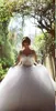 Stora Beading Muslim Bröllopsklänningar med Sheer Neckline Kristaller Illusion Sleeves Lace Up Back Plus Size Bröllopsklänning Sweep Train