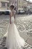 Riki Dalal Mermaid Wedding Dresses V Neck Cap Sleeves Front Split Sweep Train Backless Bridal Gowns Custom Made Beach Wedding Dress