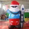 Açık Şişme Baba Noel 3 M / 5 M Yükseklik Mavi Hava Üflemeli Noel Baba Bir Sörf Tahtası Ile Kulüp Xmas Dekorasyon