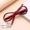 S910 Bijoux de mode vintage Handmade Pu Leather Bowknot Barrette Clip Clip Filles Fils Hairpin Dukbill Barret de dents6080820