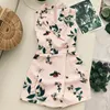 Retro kobiety Playsuits Lato Floral Print V-Neck Curt Down Collar Bez Rękawów Nieregularny Spodenki Pajaciki Damskie Boho Jumpsy 210525