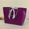 100pcs Papiergeschenke Taschen mit Griffen reine Farbe 10 Farben Kleidung Schuh Einkaufstasche Geschenkwrap 21x7x17cm