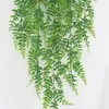 un pantalone verde appeso a vite verde artificiale in rattan 120 cm per la decorazione della parete verde della parete dell'erba di nozze domestica
