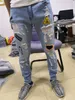Męskie dżinsy Zgrane designerskie męskie męskie szczupłe elastyczne plastry rozciągające plamy uliczne Hiphop Hole dżinsowe spodnie motocyklowe spodnie dżinsy dla mężczyzn Jean dsquared chuda