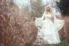 2020 Vintage Gothic Brautkleider Satin Spitze A-Linie Sweep Zug Böhmisches Hochzeitskleid Maßgeschneiderte Langarm-Brautroben De Mari￩e