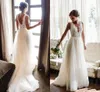 2020 Abiti da sposa economici sexy della spiaggia della Boemia una linea scollo a V applicazioni di pizzo tulle illusione aperta indietro abiti da sposa formali lunghi taglie forti