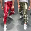 Otoño hombres de gran tamaño XXL Hip hop Harem Joggers pantalones masculinos Multi-bolsillo reflectantes rayadas de baile pantalón Pantalones Streetwear