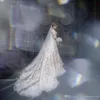 Arabic Dubai Sheer Neck Long Sleeves Lace Mermaid Wedding Dresses Tulle Applique Sweep Train Wedding Bridal Gowns with Over Skirts Vestidos