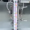自動グミキャンディートライアングルバッグパッキング機械粒状垂直形フィルシール装置