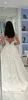セクシーな女性のウェディングドレス白いレースロングドレス深いVネックロングメッシュレーススリーブAラインプリーツの床の長さのドレス