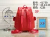 Nova bolsa feminina de couro sintético de alta qualidade para crianças, mochila escolar com molas, bolsa de viagem para senhora, vermelha e preta, bolsas de moda