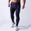 Pantaloni da jogging neri Pantaloni sportivi da uomo Pantaloni sportivi in cotone Pantaloni skinny casual Palestra maschile Allenamento fitness Autunno Abbigliamento sportivo da corsa