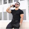 Estate Uomo PALESTRA Sport Corsa T Shirt Compressione Stretta Manica Corta Fitness Allenamento T-shirt da Bodybuilding ad Asciugatura Rapida