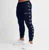 Pantaloni da jogging da uomo Pantaloni casual Fitness Uomo Abbigliamento sportivo Pantaloni da tuta Pantaloni sportivi skinny Pantaloni Palestre nere Pantaloni da jogging