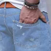 Jeans courts européens et américains Jeans à trous légers pour hommes