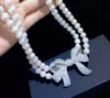 Noué à la main 43-46cm 8-9mm blanc perle d'eau douce papillon micro incrustation collier accessoires zircon