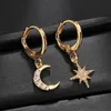 gold star dangle earrings