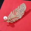 Fashion- new listing Europe and the United States fashion atmosphere rhinestone alloy feather leaf color brooch clothing accessories unisex