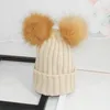 Winter dikke geribbelde gebreide hoeden voor mannen en vrouwen zoals vos bont effen kleur dubbele pluizige pompom bal geboeide beanie hoed oor bescherming