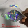 Ny ankomst 8,5x 13cm Pet Holografisk väska Tillbehör Lagringsfärg Flat Zip Lock Bags Laser Mylar Pouch Reusable Aluminium Fold Food Safe Väskor