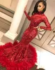 2020 Nuevos vestidos de noche de lentejuelas africanas rojas árabes Use cuello alto Sirena Lentejuelas Encaje Manga larga Pluma Longitud del piso Fiesta Vestidos de baile