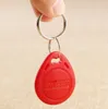 100ピースID RFID KEYFOB TK4100リモコン識別カードドアシステムエントリアクセスタグバッジトークンロック125kHz近接タグレッド