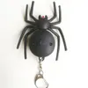 Buller-gör svart spindel nyckelring med LED-ljus