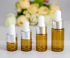 Srebrna czapka Biała guma Top 1 ml 2ml 3 ml 5ml Perfumy Essential Oil Butelki Bursztynowe Szkło Dropopowe Słoiki Butelki Fiolki z pipetą 1200 sztuk