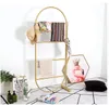 Golden clothing display rack against wall Children Furniture Simple floor-mounted hat shelf creative decorative scarf racks