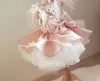 Belles robes de fille de fleur rose 2019 robe de bal à plusieurs niveaux en plumes robe de bal pour enfants première communion avec robe de concours de filles à gros arc