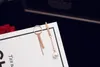 Groothandel-mode luxe designer asymmetry parel lange geometrische hanger Dangle kroonluchter oorbellen voor vrouw